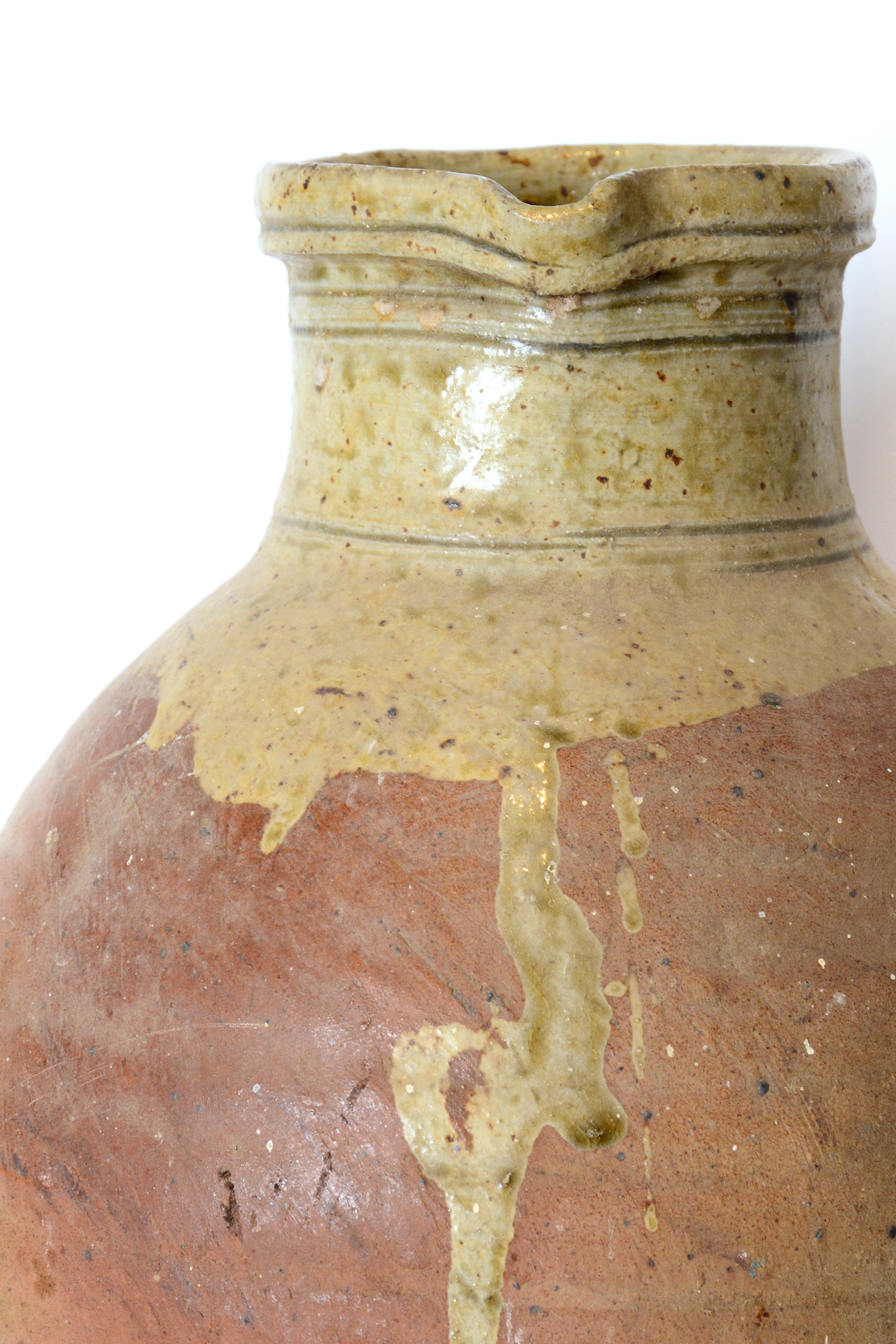 Tall antique jug with handle