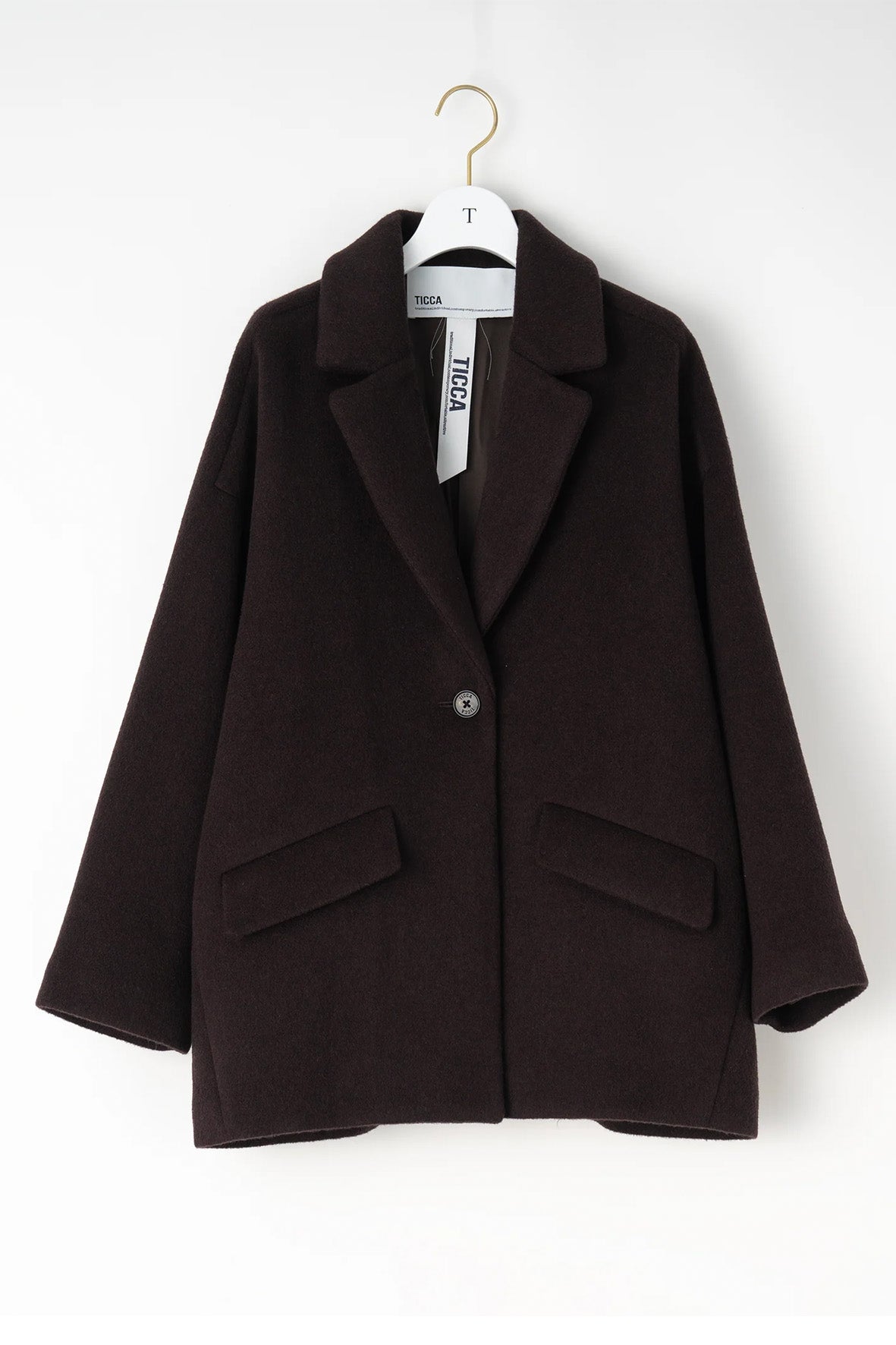 Abrigo chaqueta un botón