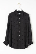 Camisa flores bordadas