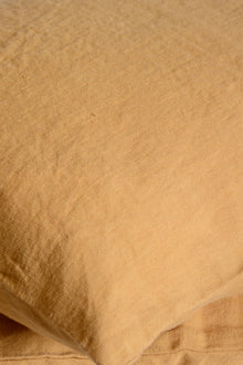 Light caramel washed linen cushion